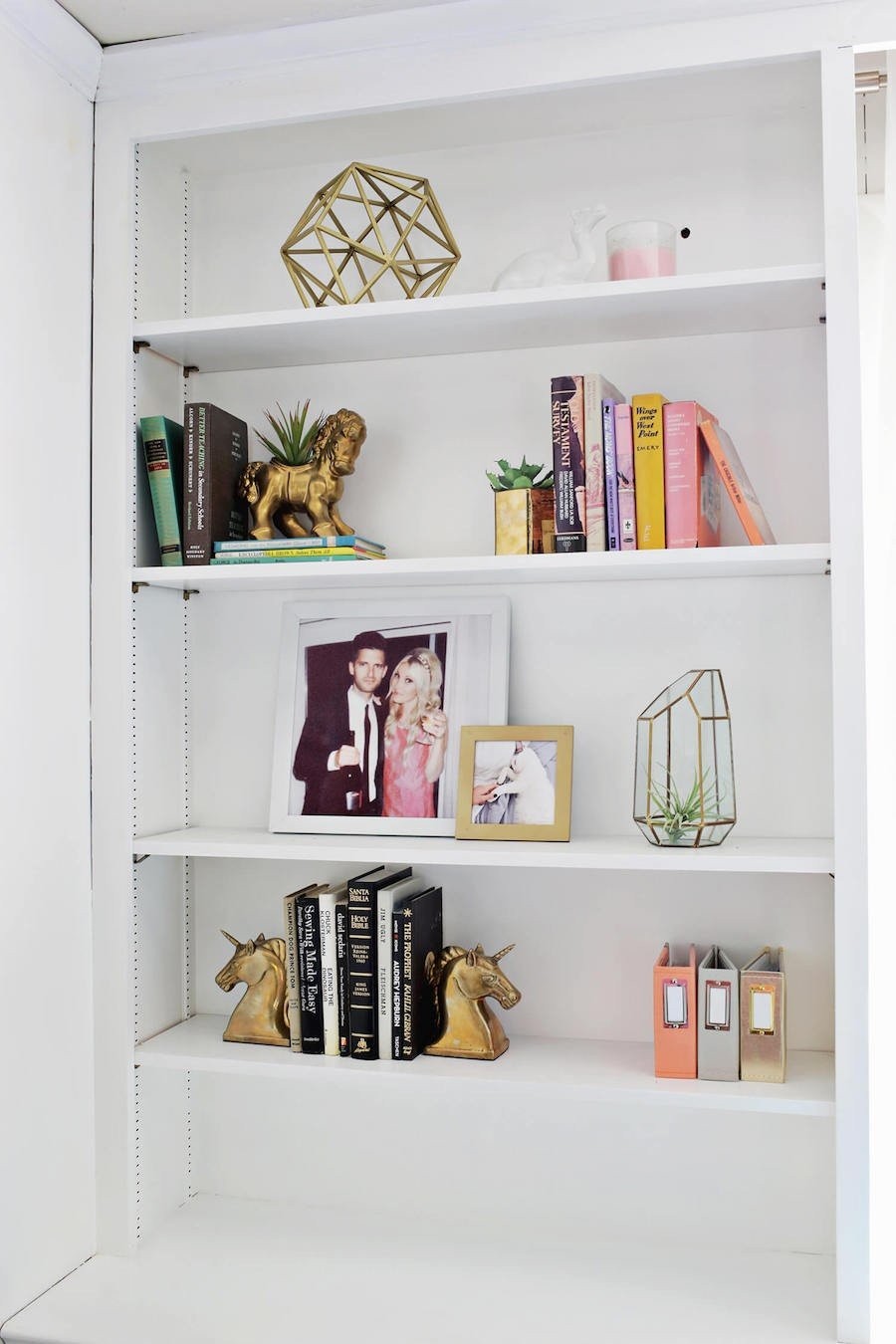 white-shelving-with-gold-sculptures.jpg