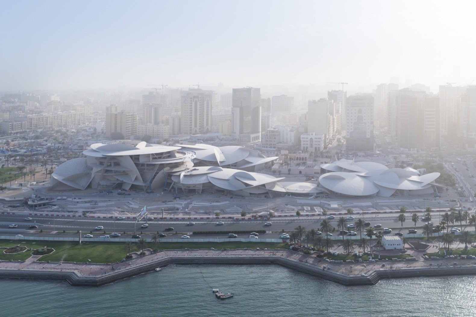 the-national-museum-of-qatar-is-located-across-from-the-doha-corniche-the-citys-main-waterfront-promenade.jpg the-national-museum-of-qatar-is-located-across-from-the-doha-corniche-the-citys-main-waterfront-promenade.jpg